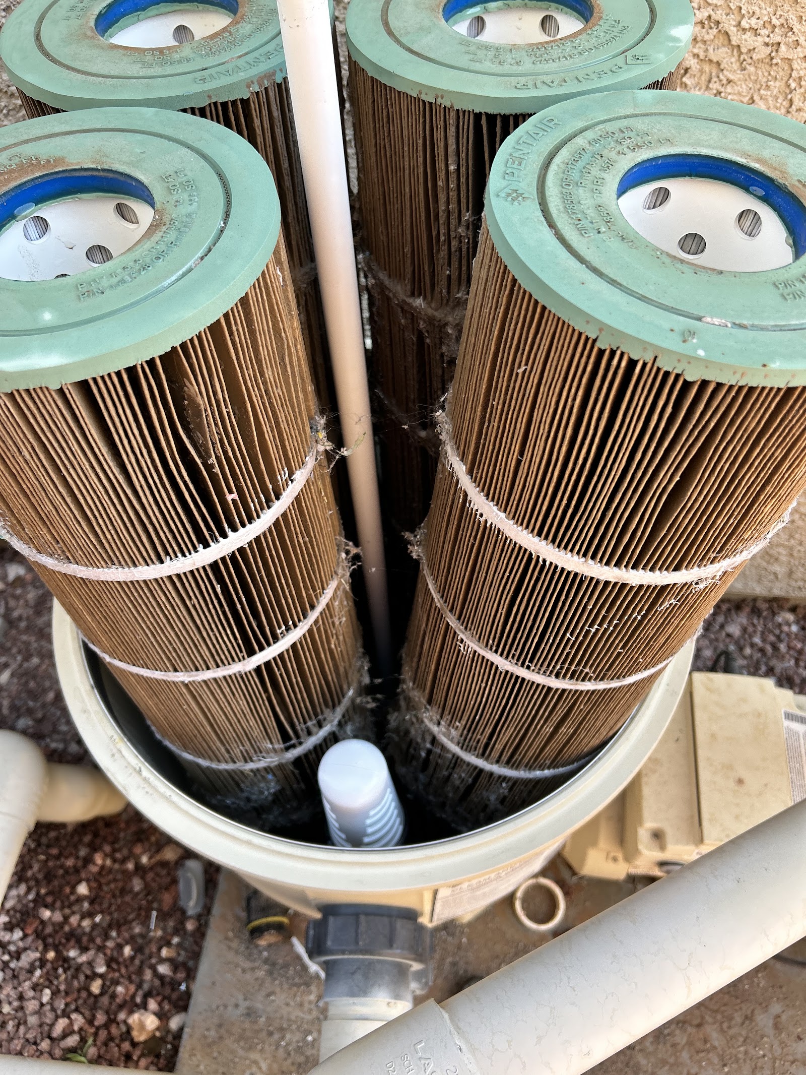 Dirty Pentair cartridge filters needing cleaning